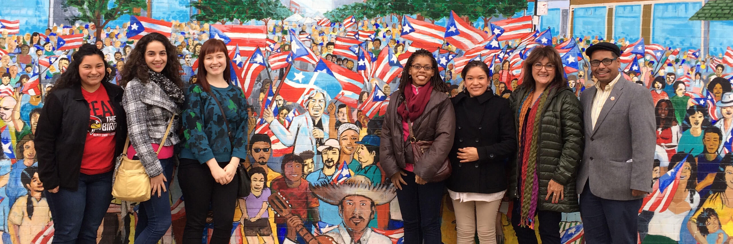 WGS students pose in front of a mural in Chicago.